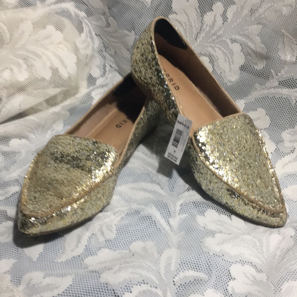 Torrid golden pointed toe flats. Size 9 wide.